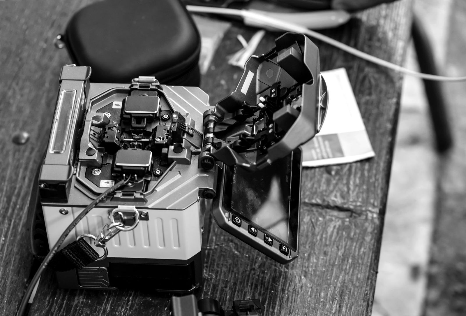 Fibre optic splicing machine on a workbench