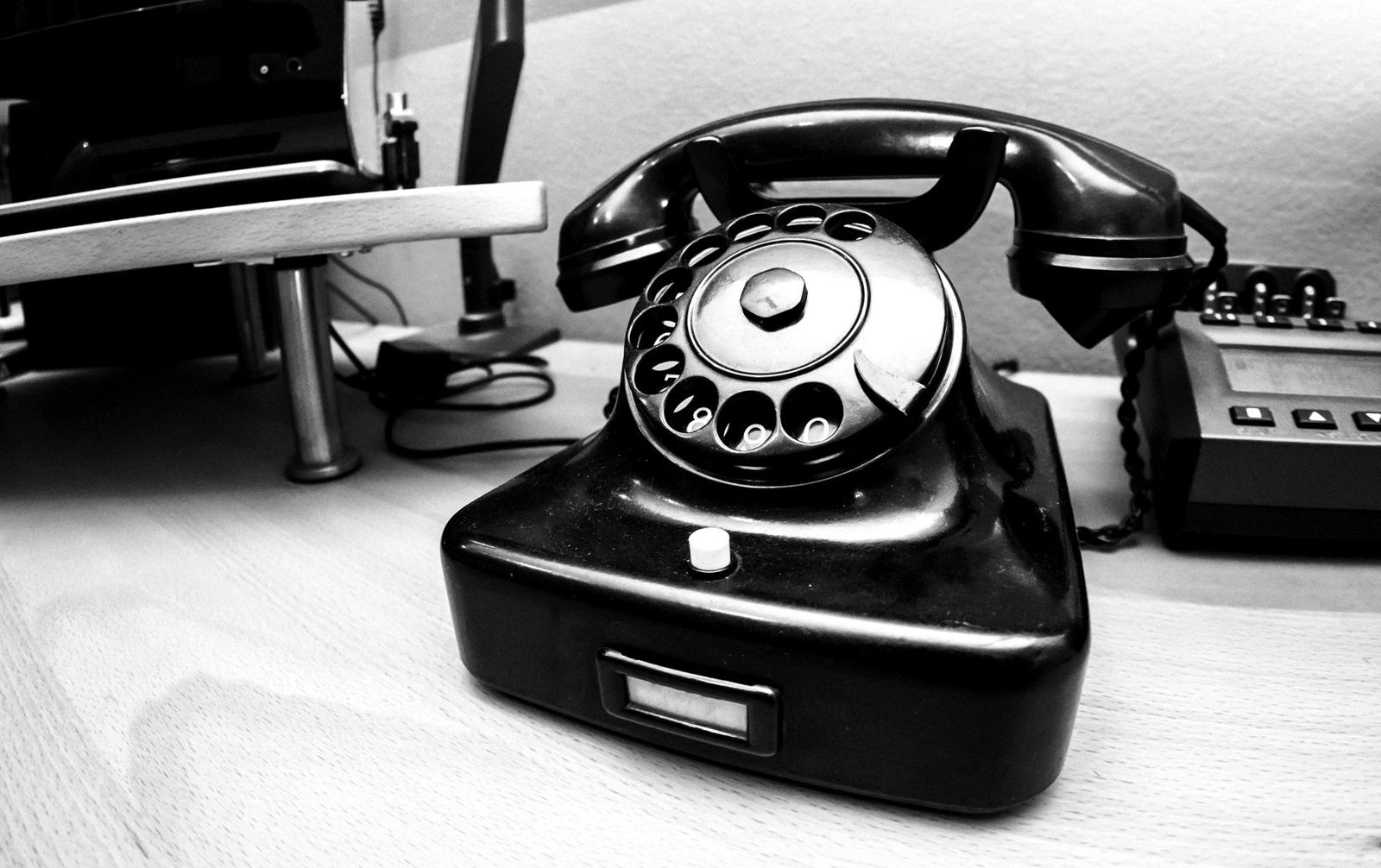Rotary telephone on a desk
